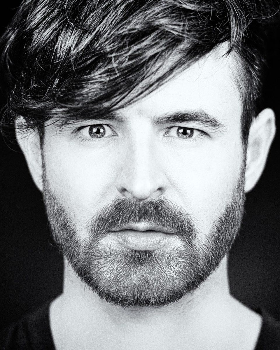 Black-and-white portrait of Mark Jago